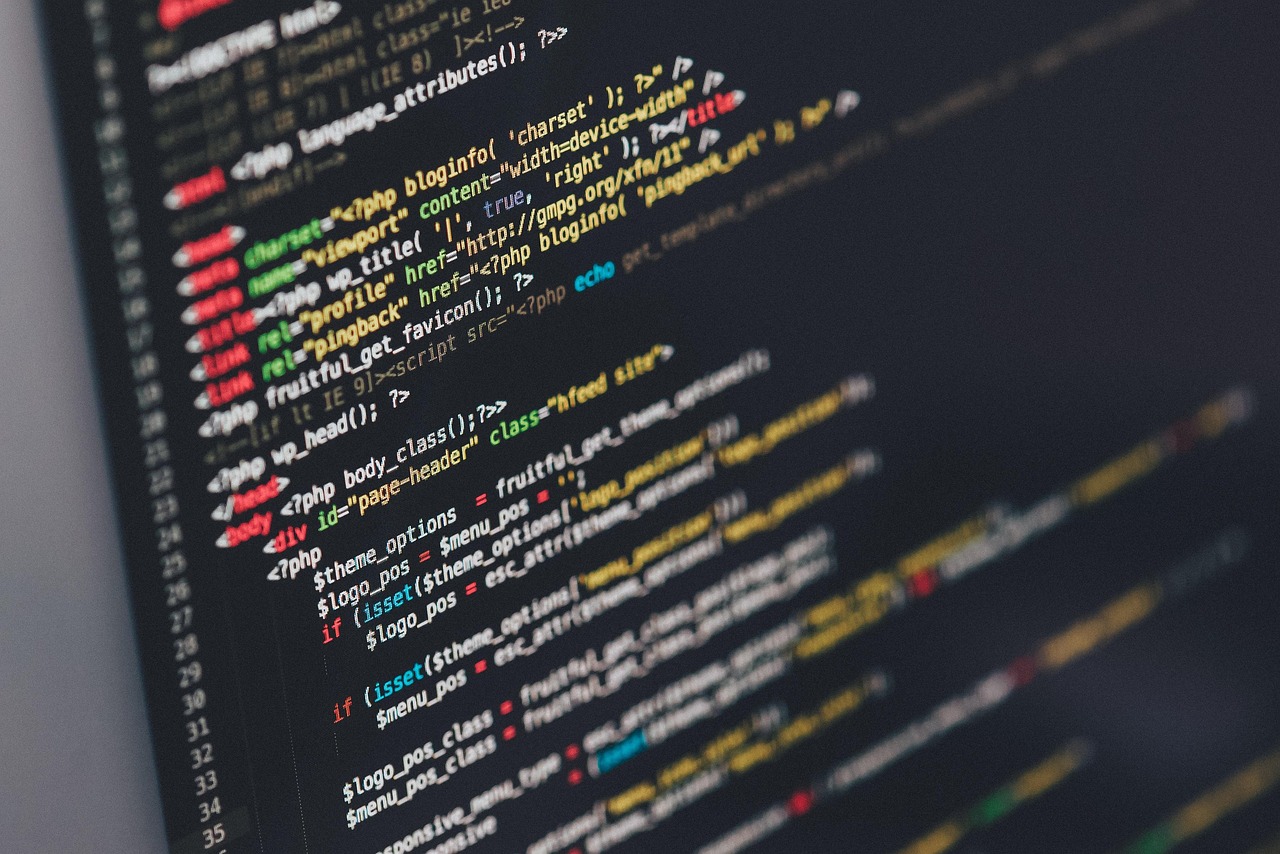 Code visible across a workstation display